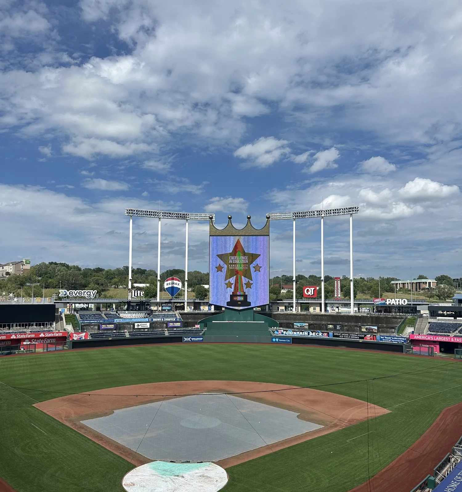 A Kansas City stadium before an evening awards programme, the scoreboard carrying the event graphic.